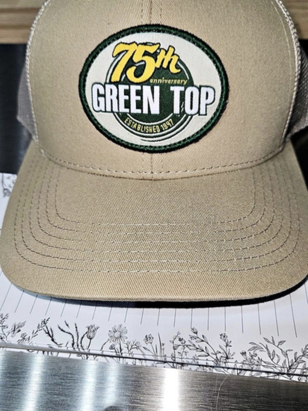Green Top 75th Anniversary Trucker Hat in Beige